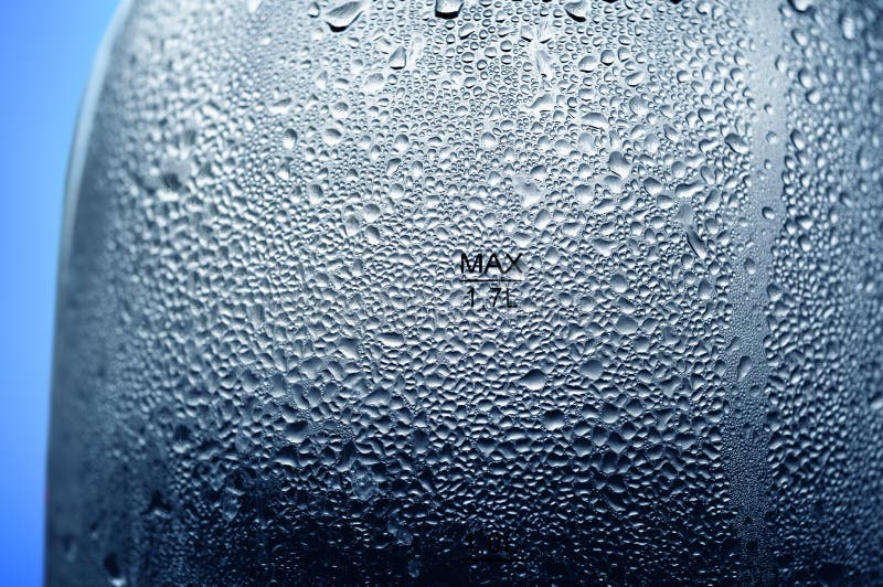 Texture of Water Drops on Electric Kettles on a Blue Stock Image