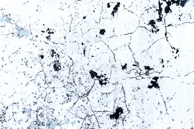 Texture of Whitewashed Concrete Wall with Cracks and Spots Stock Photo