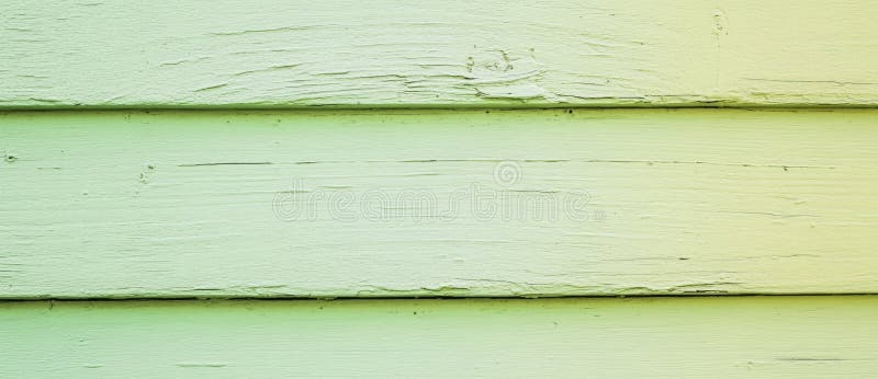 A textured background of green wooden boards, featuring copy space for text and design elements stock photo