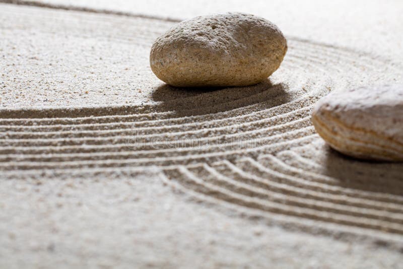 Textured pebbles across sinuous waves for spirituality