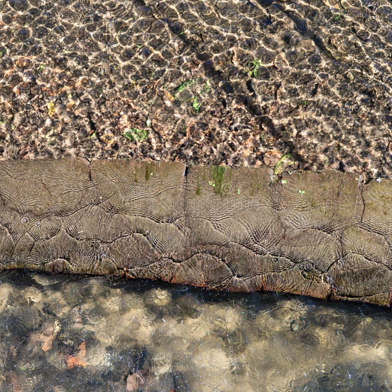 Textured pound ground created by sun reflection in the clear, transparent, water. High angle square view over a textured pound ground created by sun reflection royalty free stock photography Textured pound ground created by sun reflection in the clear, transparent, water. High angle square view over a textured pound ground created by sun reflection royalty free stock photography