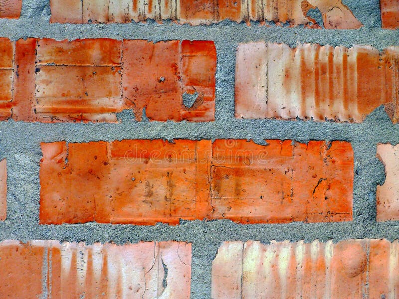 Textured red and gray brick wall pattern close-up detail
