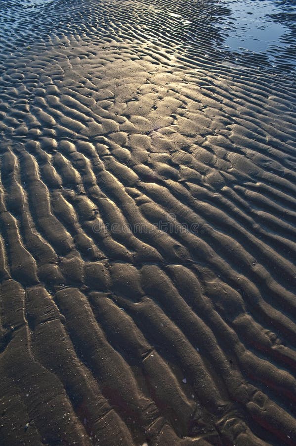 Textured sand on a beach stock photography