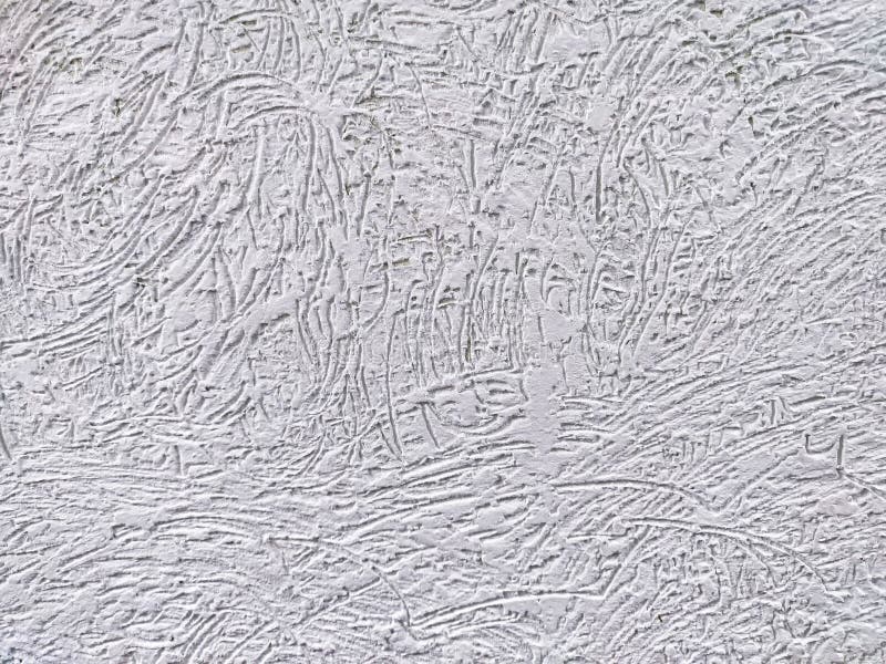 Textured wall surface with unique patterns and lines under soft lighting royalty free stock photos