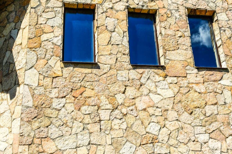 New stylish country house. Building with Windows made of natural stone. stock photography New stylish country house. Building with Windows made of natural stone. stock photography