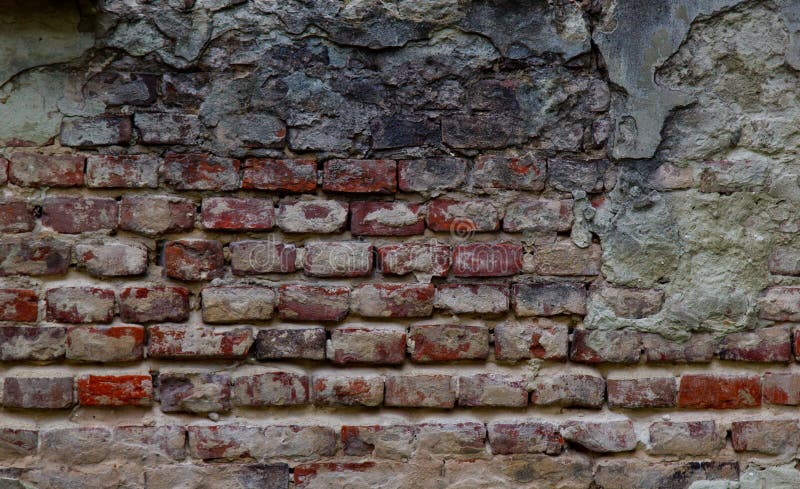 Texturice de una pared de ladrillo roja de peladura muy vieja cubierta con el primer del yeso tiempo que rompe el fondo imagenes de archivo Texturice de una pared de ladrillo roja de peladura muy vieja cubierta con el primer del yeso tiempo que rompe el fondo imagenes de archivo