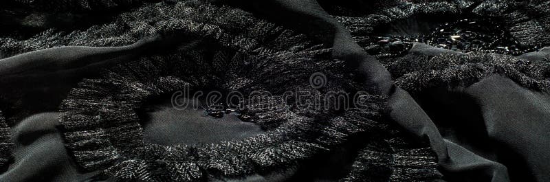 Texture, background, pattern. Black silk fabric. With sewn patterns. Elegant and eclectic, turn this gray abstract printed silk georget into something incredible! Violet-gray, black,. Texture, background, pattern. Black silk fabric. With sewn patterns. Elegant and eclectic, turn this gray abstract printed silk georget into something incredible! Violet-gray, black,