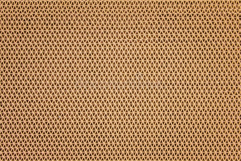 Textuur bruine plastic rubberdeurmat in de patronen van de rimpelingsvorm op achtergrond stock afbeeldingen Textuur bruine plastic rubberdeurmat in de patronen van de rimpelingsvorm op achtergrond stock afbeeldingen