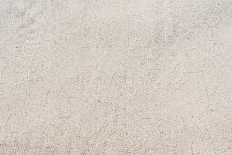 Textuur van een in reliëf gemaakte antieke concrete muur met barsten en een geruïneerde pleister beschermende laag royalty-vrije stock foto's Textuur van een in reliëf gemaakte antieke concrete muur met barsten en een geruïneerde pleister beschermende laag royalty-vrije stock foto's