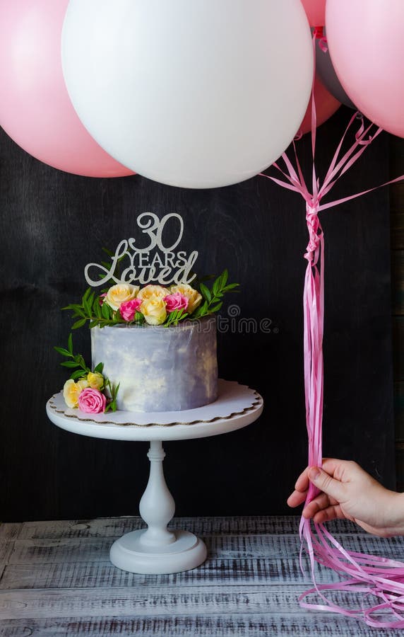 30th anniversary cake with roses on cake stand