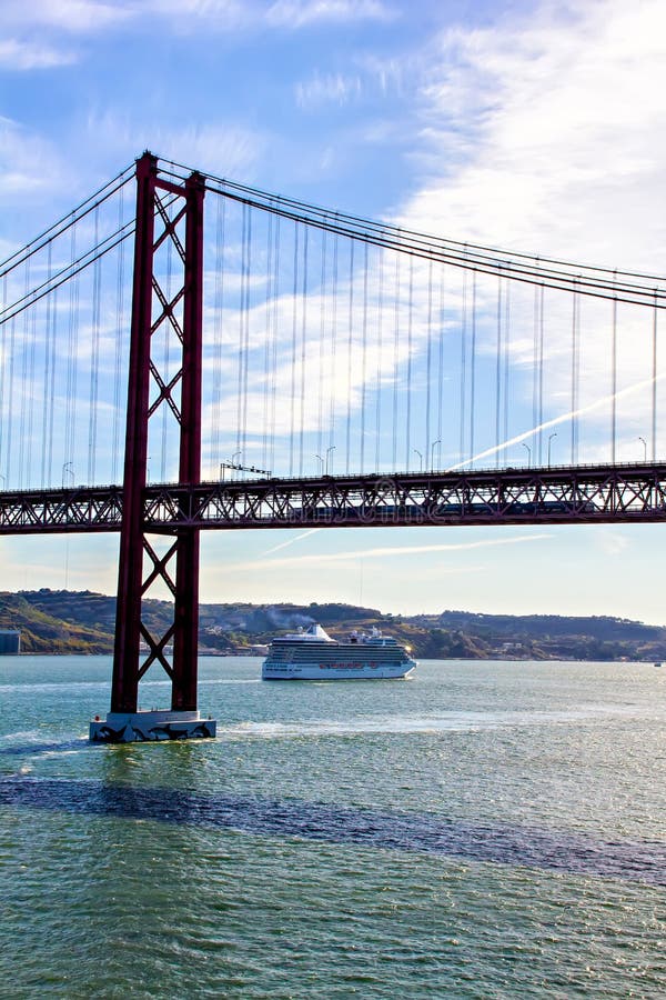 25th of April bridge and cruise ship stock image