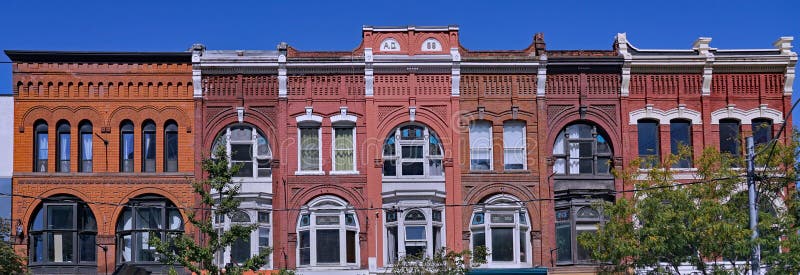 Block of ornate 19th century building facades in Toronto, Queen Street West, apartments above stores