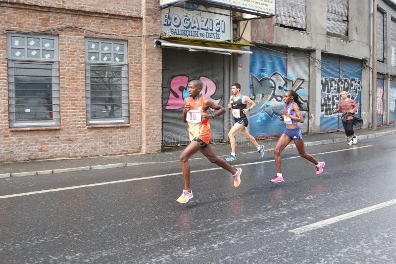 ISTANBUL, TURKEY - APRIL 26, 2015: Athletes are running in Old Town streets of Istanbul during Vodafone 10th Istanbul Half Marathon. ISTANBUL, TURKEY - APRIL 26, 2015: Athletes are running in Old Town streets of Istanbul during Vodafone 10th Istanbul Half Marathon