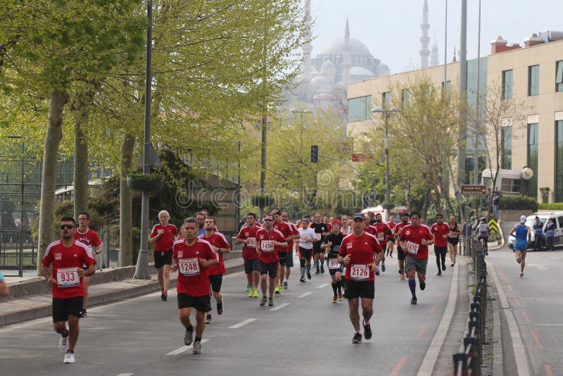 ISTANBUL, TURKEY - APRIL 26, 2015: Athletes are running in Old Town streets of Istanbul during Vodafone 10th Istanbul Half Marathon. ISTANBUL, TURKEY - APRIL 26, 2015: Athletes are running in Old Town streets of Istanbul during Vodafone 10th Istanbul Half Marathon