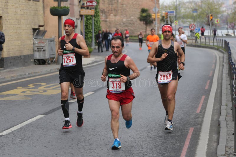 ISTANBUL, TURKEY - APRIL 26, 2015: Athletes are running in Old Town streets of Istanbul during Vodafone 10th Istanbul Half Marathon. ISTANBUL, TURKEY - APRIL 26, 2015: Athletes are running in Old Town streets of Istanbul during Vodafone 10th Istanbul Half Marathon