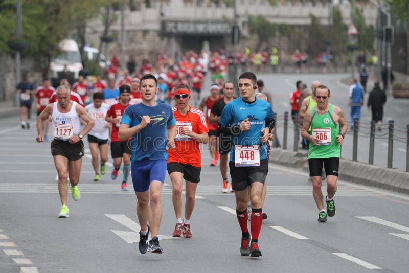 ISTANBUL, TURKEY - APRIL 26, 2015: Athletes are running in Old Town streets of Istanbul during Vodafone 10th Istanbul Half Marathon. ISTANBUL, TURKEY - APRIL 26, 2015: Athletes are running in Old Town streets of Istanbul during Vodafone 10th Istanbul Half Marathon