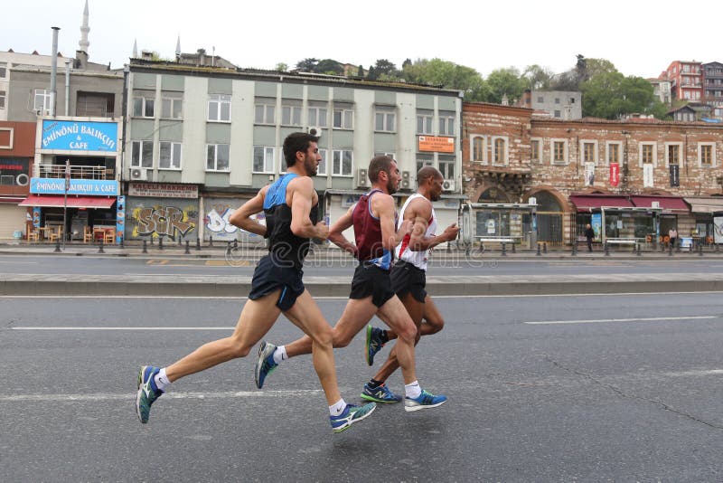 ISTANBUL, TURKEY - APRIL 26, 2015: Athletes are running in Old Town streets of Istanbul during Vodafone 10th Istanbul Half Marathon. ISTANBUL, TURKEY - APRIL 26, 2015: Athletes are running in Old Town streets of Istanbul during Vodafone 10th Istanbul Half Marathon