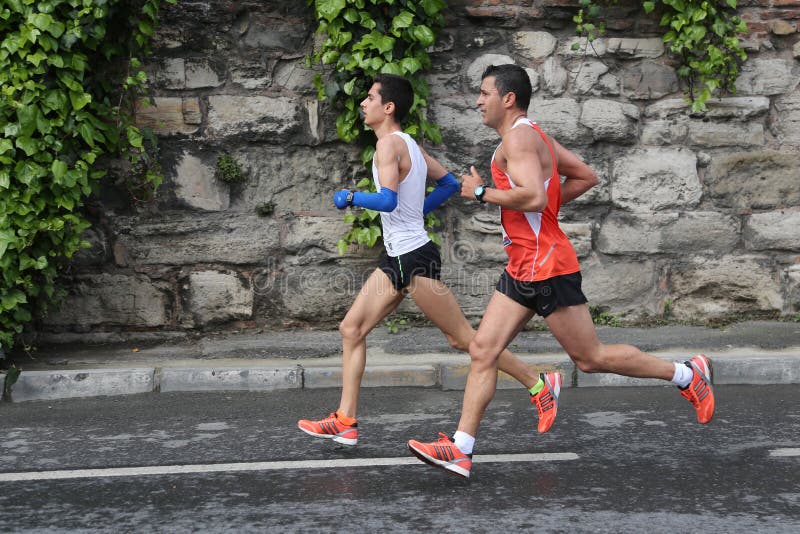 ISTANBUL, TURKEY - APRIL 26, 2015: Athletes are running in Old Town streets of Istanbul during Vodafone 10th Istanbul Half Marathon. ISTANBUL, TURKEY - APRIL 26, 2015: Athletes are running in Old Town streets of Istanbul during Vodafone 10th Istanbul Half Marathon