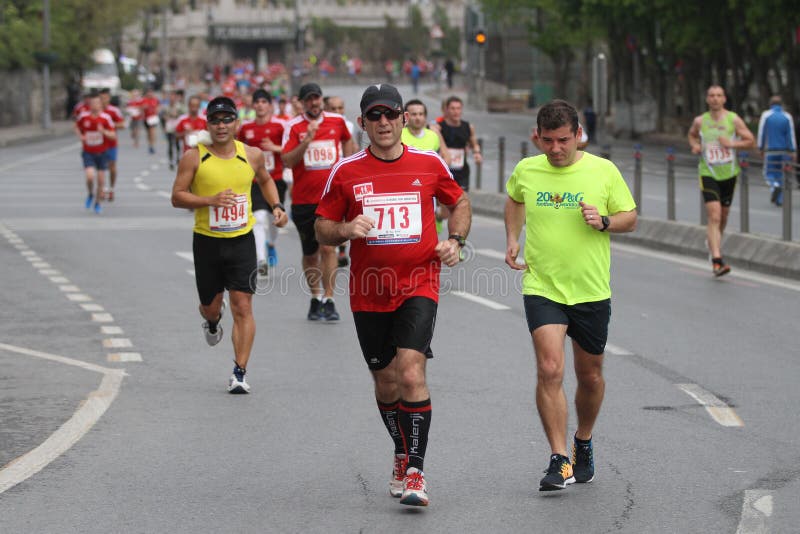 ISTANBUL, TURKEY - APRIL 26, 2015: Athletes are running in Old Town streets of Istanbul during Vodafone 10th Istanbul Half Marathon. ISTANBUL, TURKEY - APRIL 26, 2015: Athletes are running in Old Town streets of Istanbul during Vodafone 10th Istanbul Half Marathon