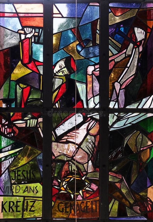 11th Stations of the Cross, Crucifixion: Jesus is nailed to the cross, stained glass window in Saint Lawrence church in Kleinostheim, Germany. 11th Stations of the Cross, Crucifixion: Jesus is nailed to the cross, stained glass window in Saint Lawrence church in Kleinostheim, Germany.