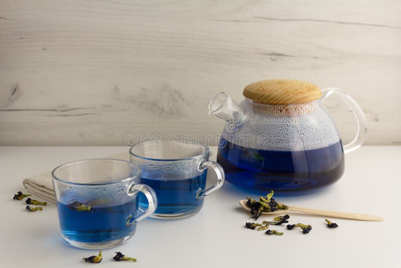 Thai Blue Tea in a Glass Teapot on a Light Background Stock Photo