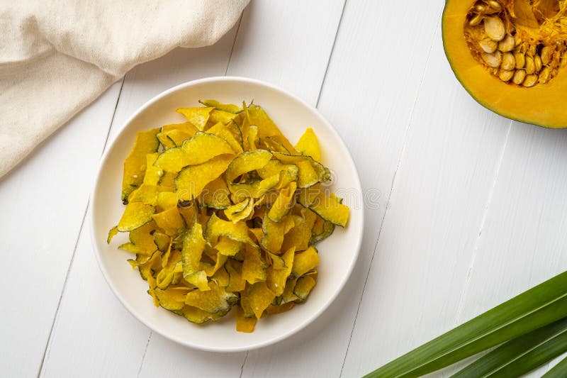 Thai Crispy Pumpkin Snack, Health Pumpkin Chips on White Plate Stock