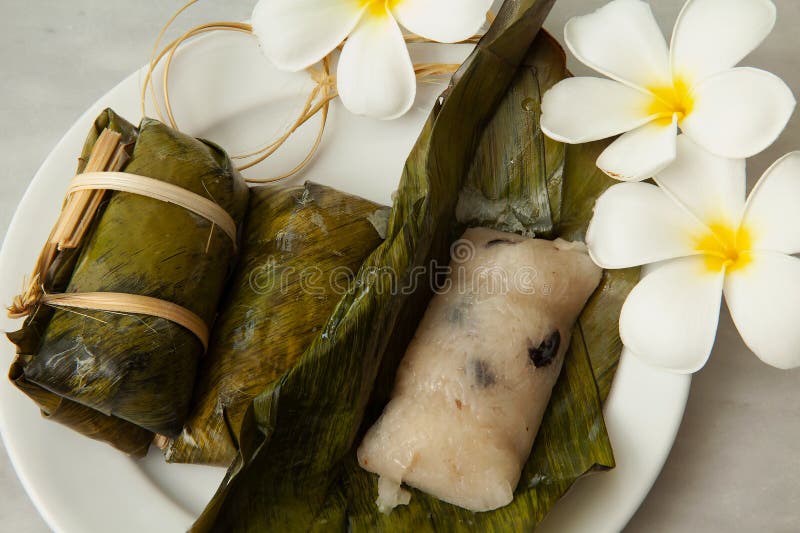 Thai Desserts, Porridge tie, Sticky rice wrapped in banana leaves, Banana filling, Steamed cooked food