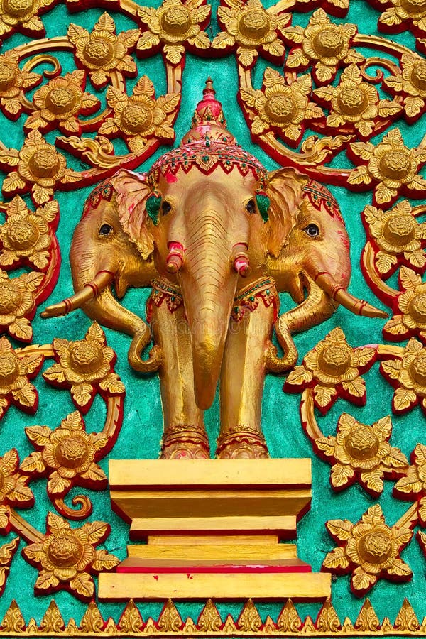 Thai elephant statues in temple door.
