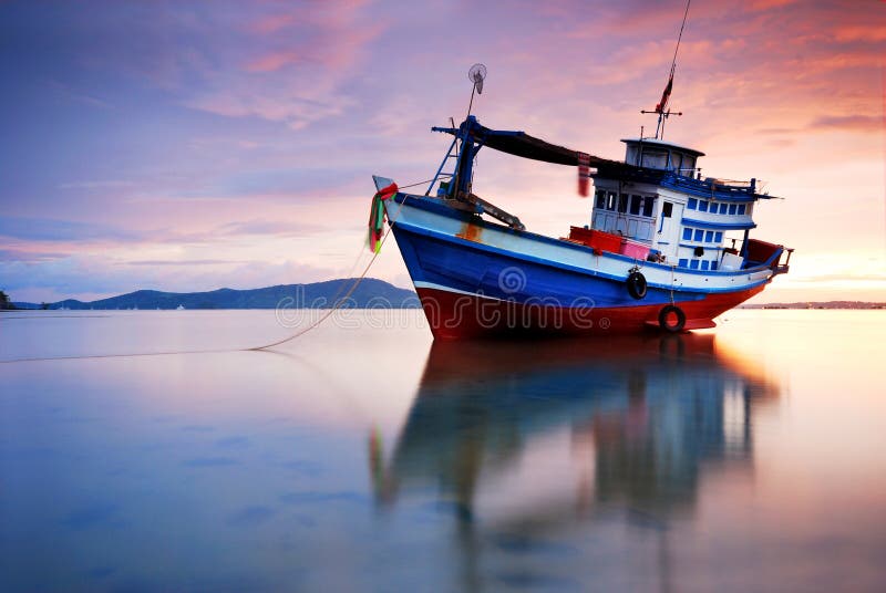 Thai fishing boat at sunset