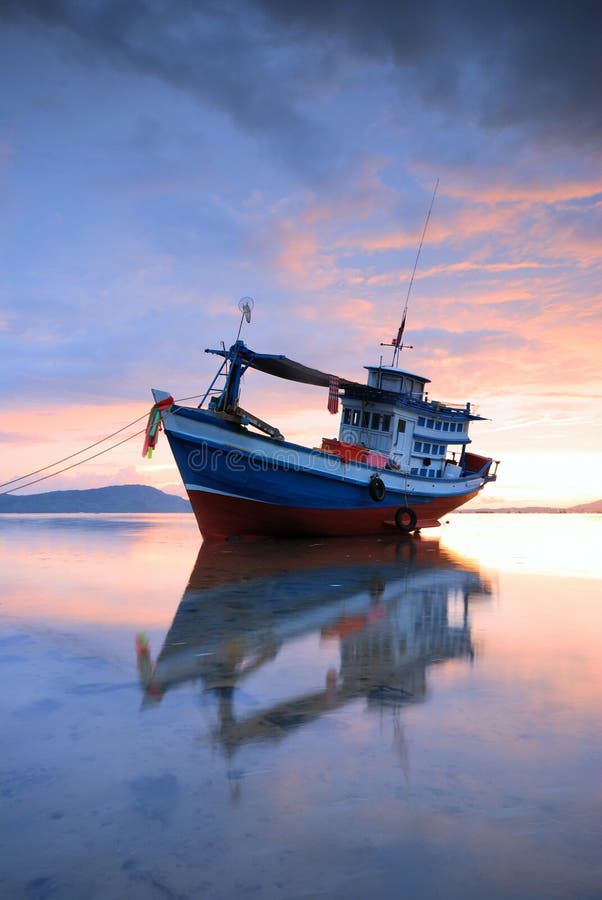 Thai fishing boat at sunset