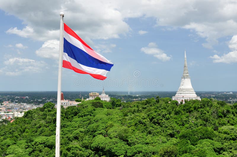 Thai Flag & White Pagoda in Khao Wang Royal Palace. Phra Nakhon Khiri (Khao Wang) is a historical park in Phetchaburi, Thailand, located on a hill overlooking royalty free stock images Thai Flag & White Pagoda in Khao Wang Royal Palace. Phra Nakhon Khiri (Khao Wang) is a historical park in Phetchaburi, Thailand, located on a hill overlooking royalty free stock images