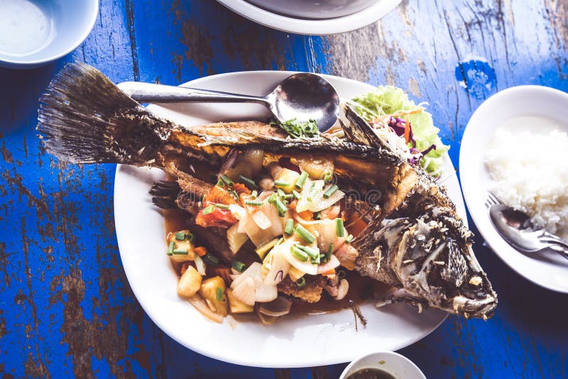 Thai Food, Fried Fish with Thai Three Flavored Sauce. Stock Photo
