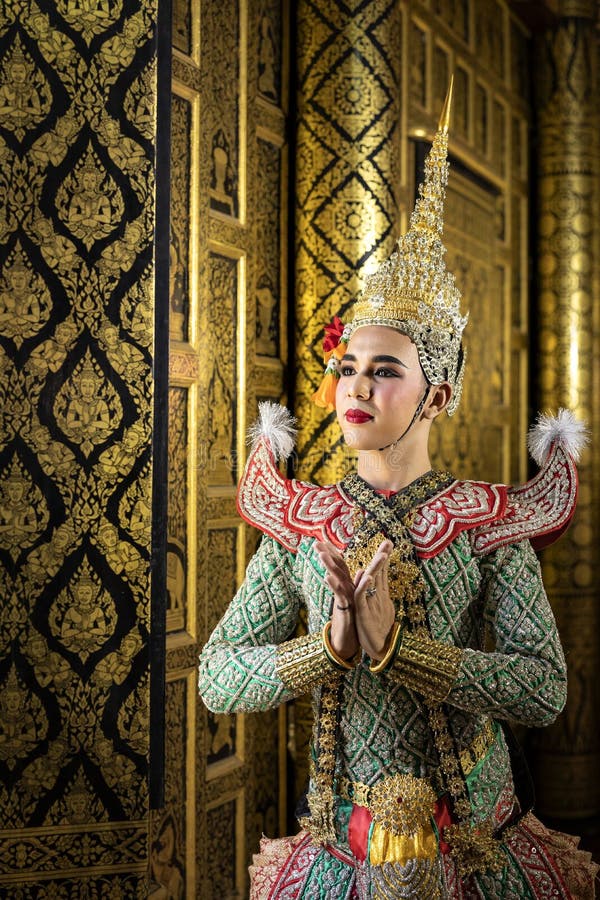 Thai pantomime character In the role of Rama Standing at the house of ancient Thai style, golden beauty