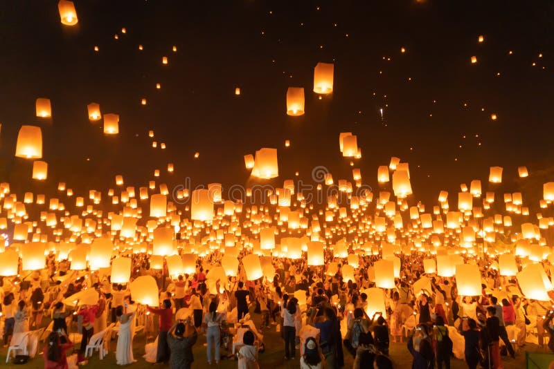 Thai people release sky floating lanterns or lamp to worship Buddha`s relics at night. Traditional festival in Chiang mai