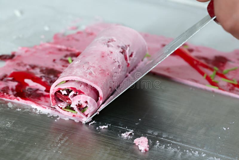 Thai roll ice cream is made by hand on the freezer. Sweet dessert made from natural berries and ingredients. The process. Of making food royalty free stock photos Thai roll ice cream is made by hand on the freezer. Sweet dessert made from natural berries and ingredients. The process. Of making food royalty free stock photos