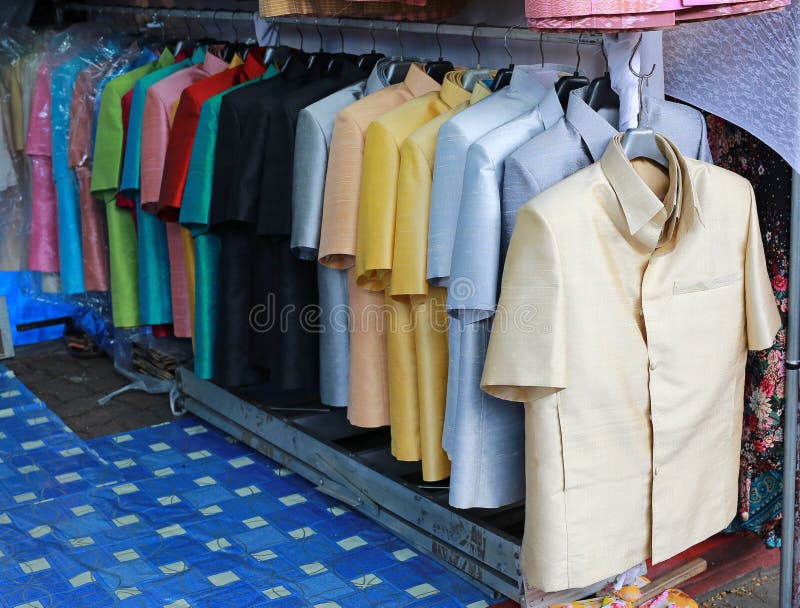 Thai silk suit hanging in shop.