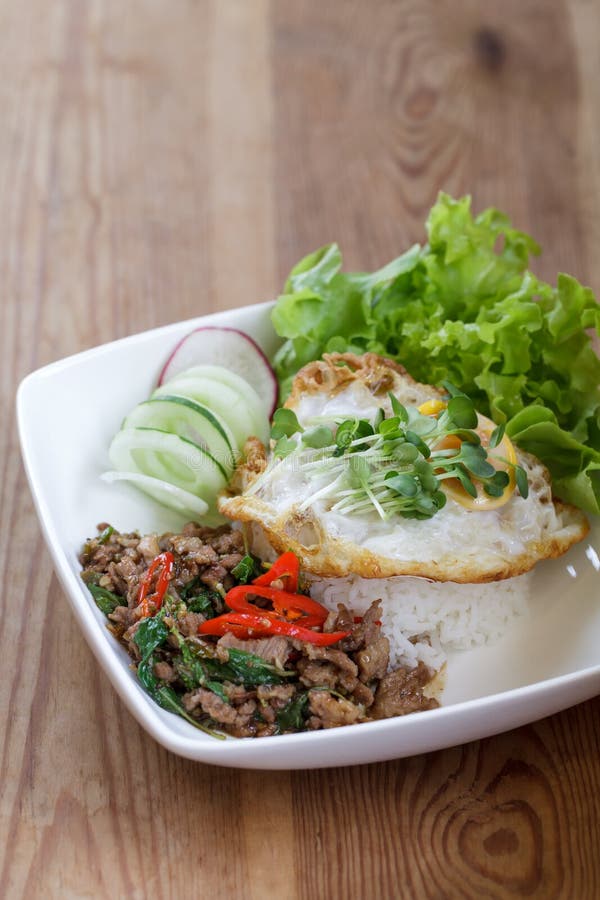 Thai Spicy Food Basil Pork Fried Rice Recipe with Egg Stock Image