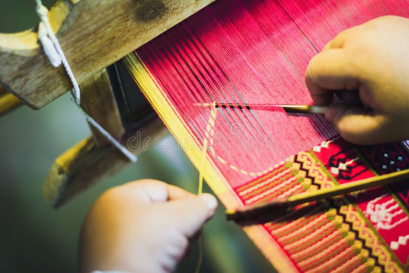 Thai woman making silk thread. stock photos