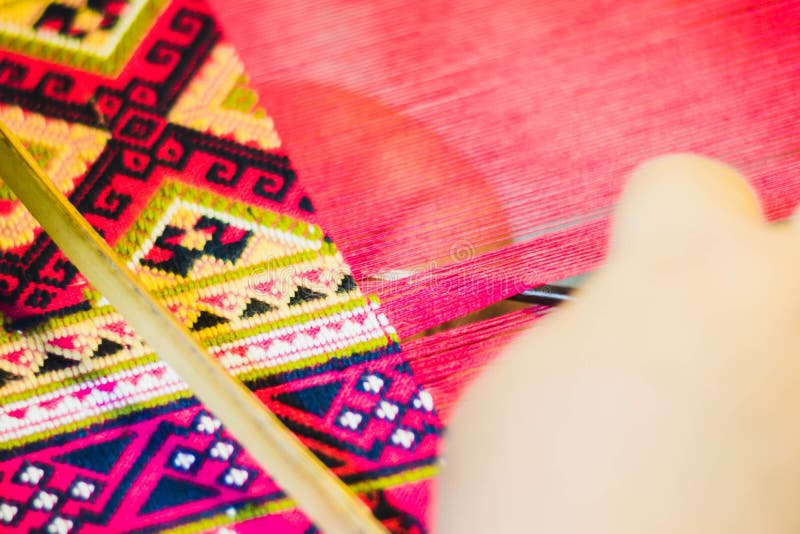 Thai woman making silk thread. stock photography