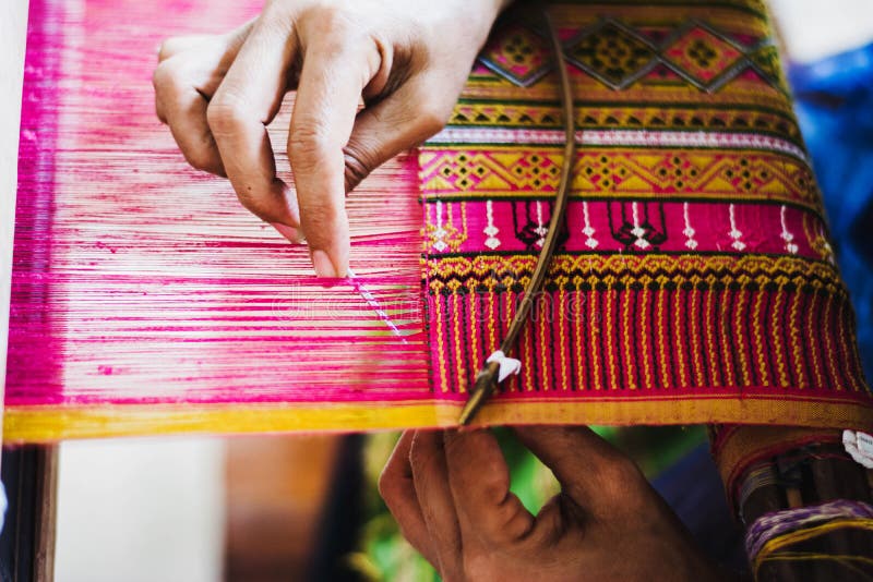 Thai woman making silk thread. stock images
