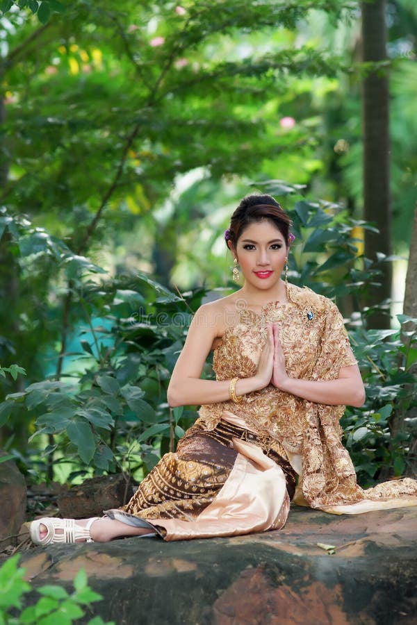 Asian Woman Wearing Traditional Thai Culture At Temple 