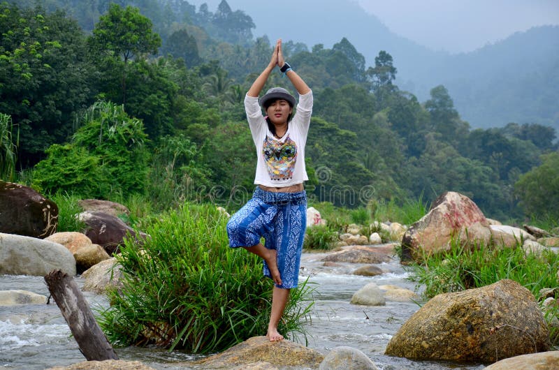 Thai women playing yoga at Taha Waterfalls