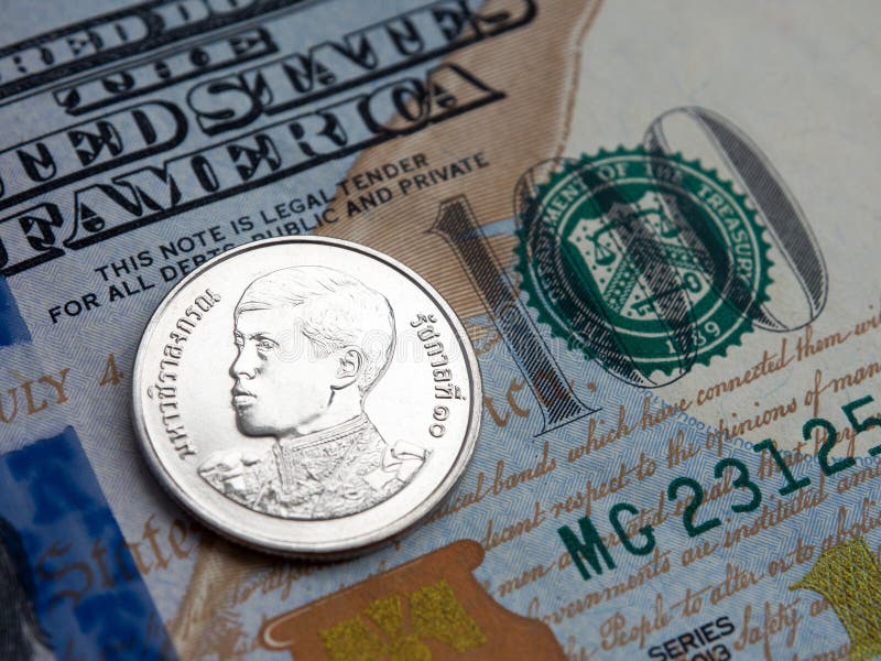 Thailand Baht To Us Dollar Exchange On Dollars Background Stock Photo thailand-baht-to-us-dollar-exchange-on-dollars-background-stock-photo