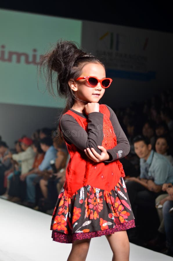 THAILAND, BANGKOK- OCTOBER 2013 : A model walks the runway at Kids Internation Fashion Week 2013 during 5-6 on october, 2013 in B