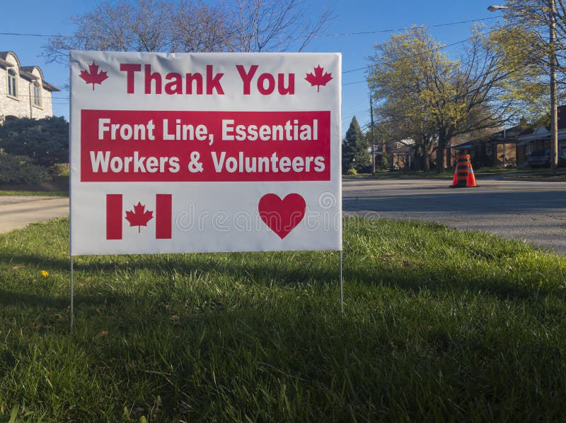 Thank you front line, essential workers & volunteers sign in front of a house during corona virus pandemic outbreak royalty free stock photography