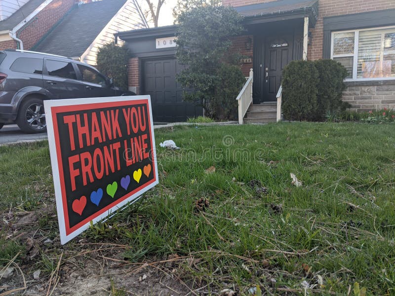Thank you front line, essential workers & volunteers sign in front of a house during corona virus pandemic outbreak royalty free stock images