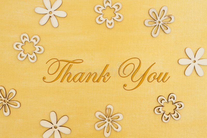 Thank you message with wood flower petals on hand painted distressed gold royalty free stock photography Thank you message with wood flower petals on hand painted distressed gold royalty free stock photography