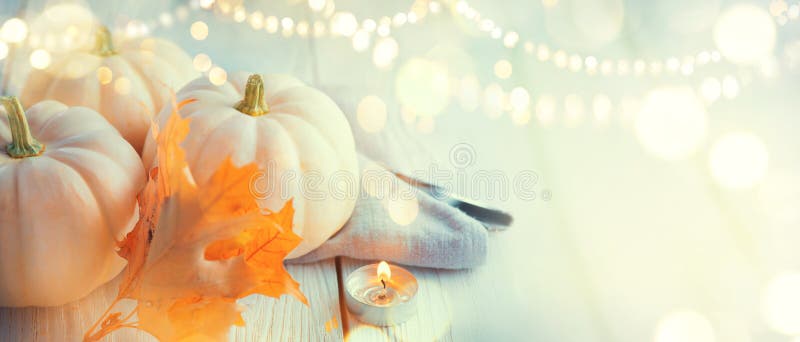 Thanksgiving background. Wooden table, decorated with pumpkins, autumn leaves and candles royalty free stock photography Thanksgiving background. Wooden table, decorated with pumpkins, autumn leaves and candles royalty free stock photography