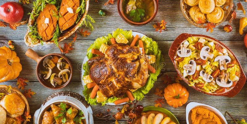 Thanksgiving dinner setting on rustic wooden table