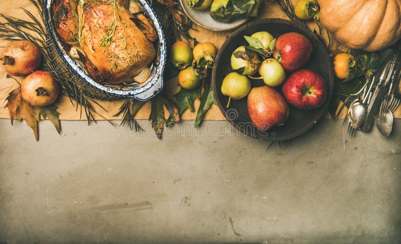 Thanksgiving dinner table setting with roasted chicken or turkey royalty free stock photo Thanksgiving dinner table setting with roasted chicken or turkey royalty free stock photo